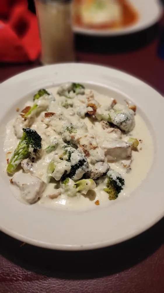 Alfredo Sauce Served over Grilled Chicken and Broccoli